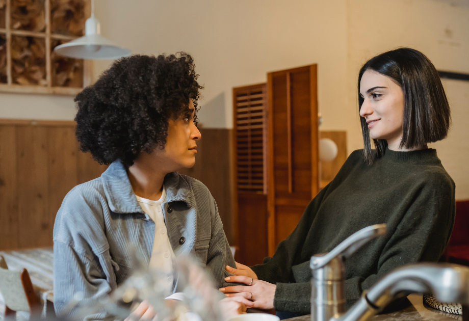 a woman comforting another woman during a hard conversation